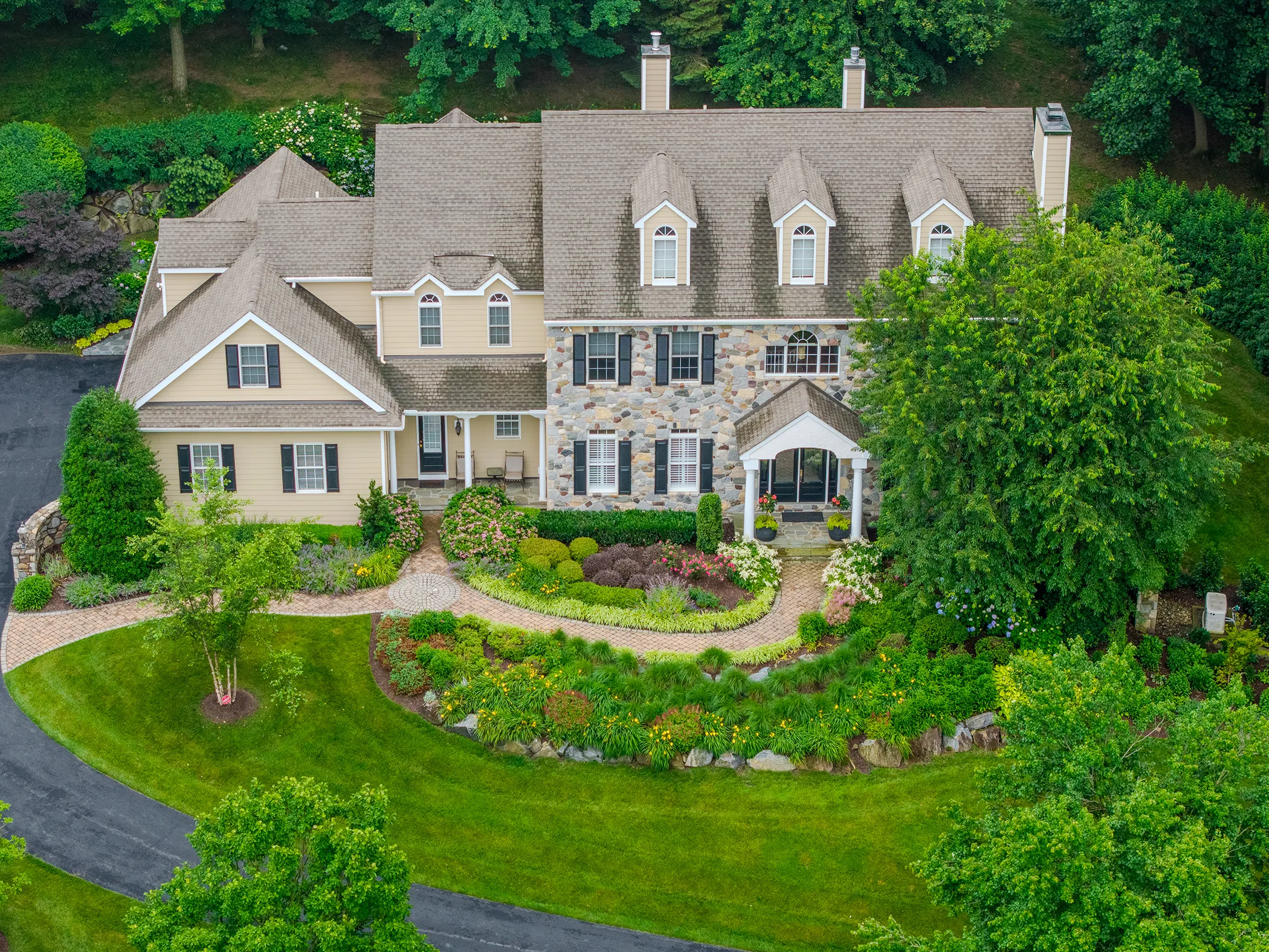 Aerial view of stone Colonial residence with full front landscape design and planting installation, Kennett Square PA, Eastern Horticultural Services
