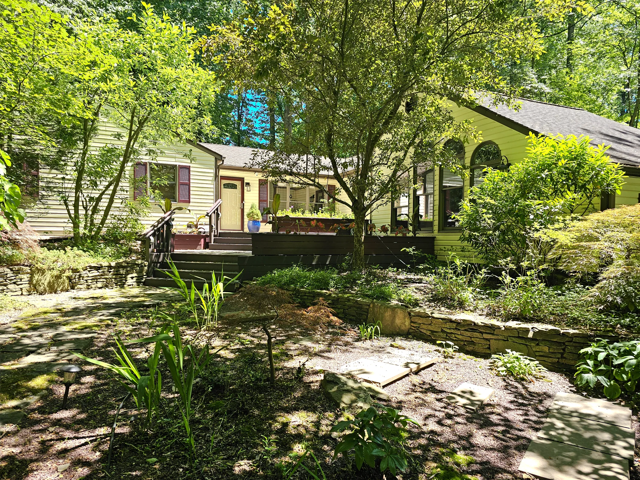 Before photo of North Star residence showing original wood deck and front entry approach, North Star, Delaware