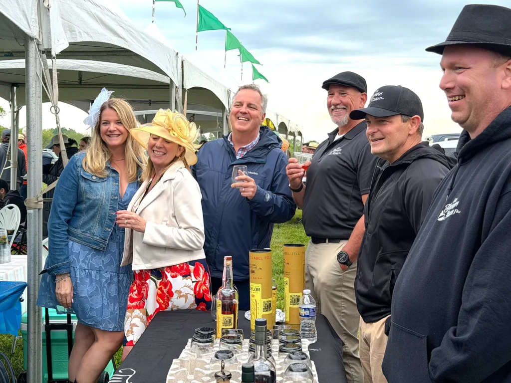 John Winterbottom with guests and The Bourbon Assault at the Eastern Horticultural Services tent at the 2026 Willowdale Steeplechase