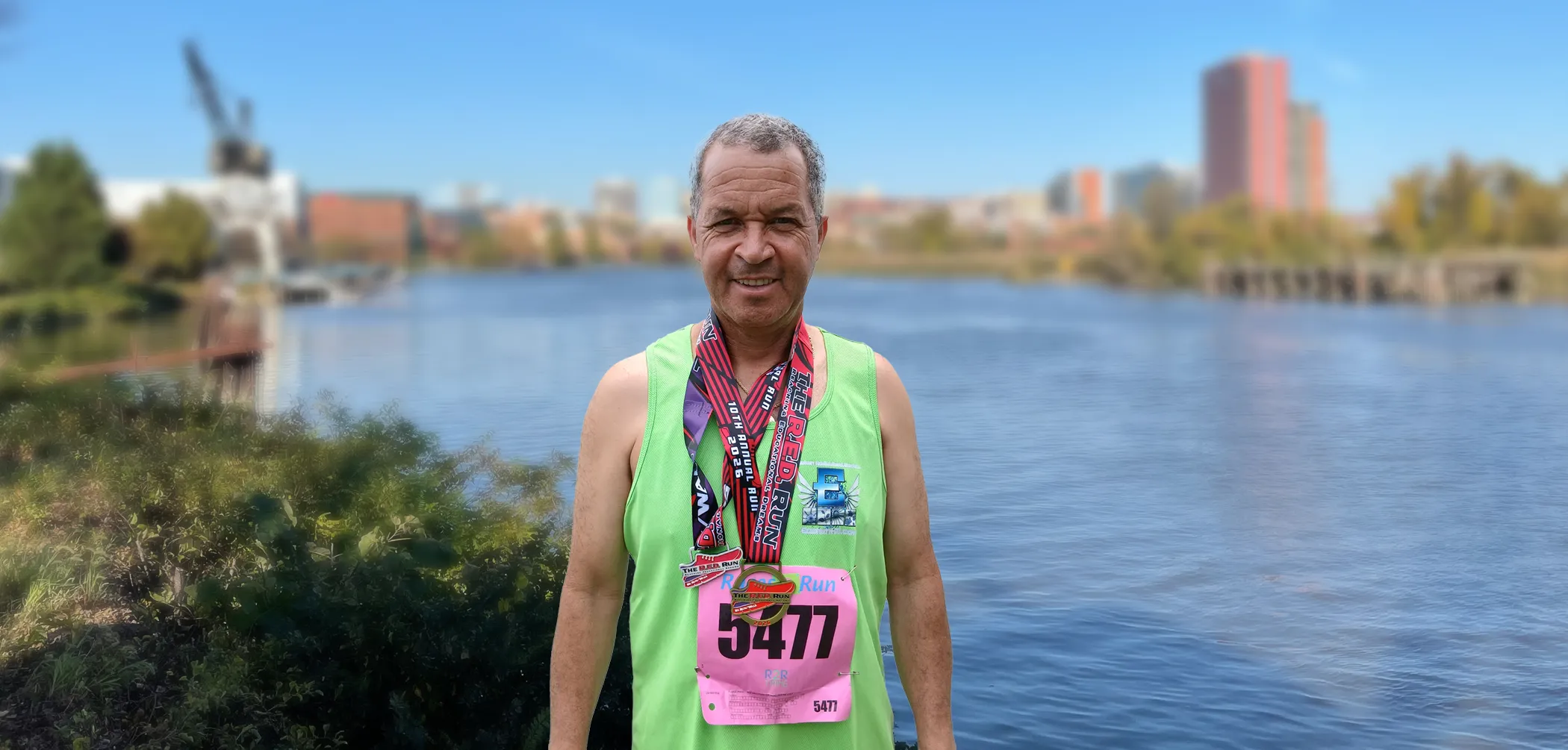 Gerardo Rivas wearing Eastern Horticultural Services gear after finishing the 10th Annual R.E.D. 5K in Wilmington, Delaware, June 2026