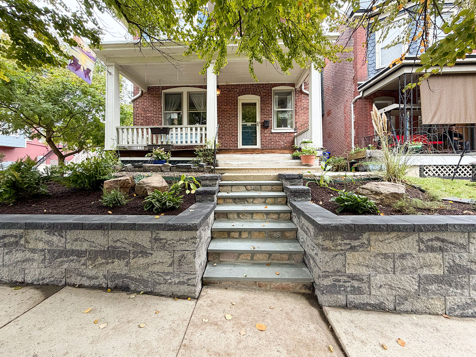 Belgard Diamond Pro retaining walls on both sides of new bluestone front steps at a brick rowhome in Wilmington